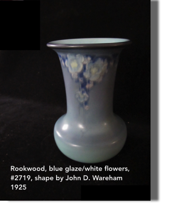 #2719, 1925 blue glaze vase with white flowers, 6.50 high, shape designed by John D. Wareham XXV, lovely white flowers.