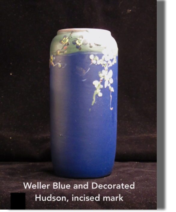 Blue and decorated Hudson (incised Weller), 7.5" high, blue body with different blue/green on rim lovely white flowers with pink accents